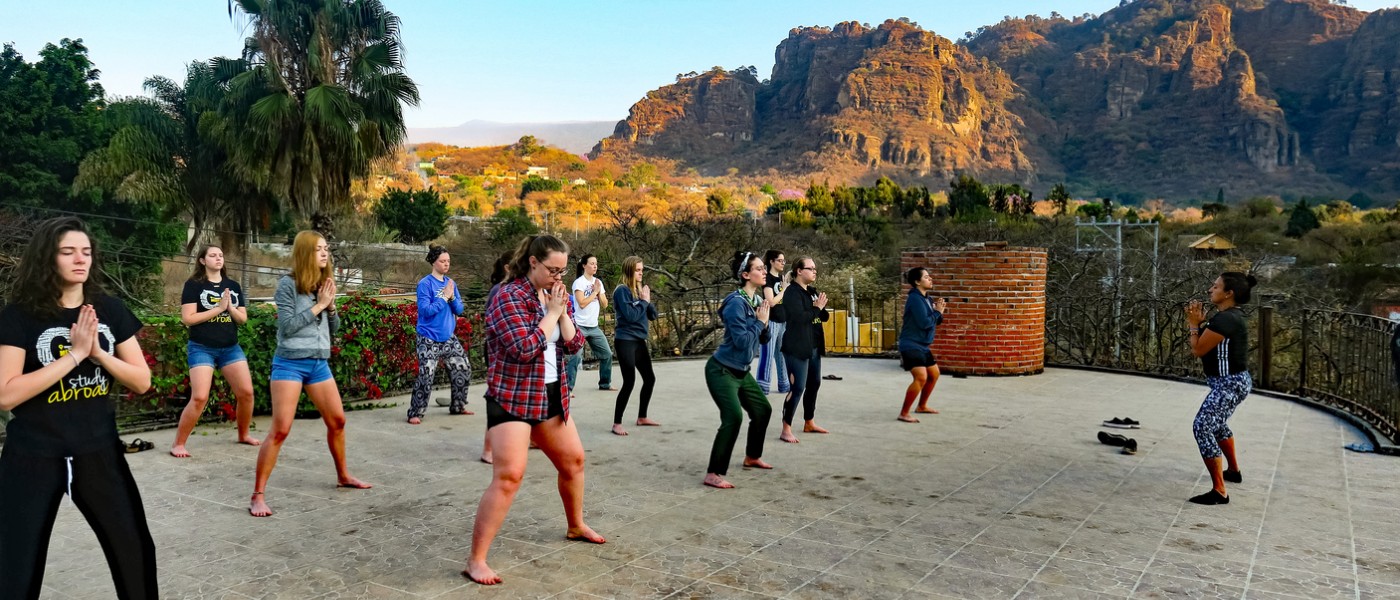 ֱ students doing yoga in Mexico